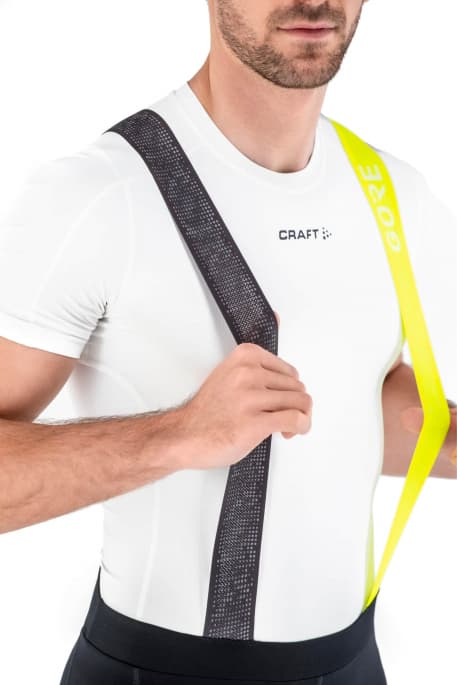 Man in bike apparel fashion t-shirt suspenders photo
